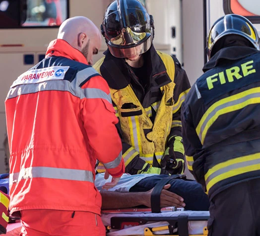 Fire and EMS helping a victim